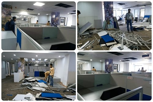Office dismantling in progress — partitions and false ceiling coming down