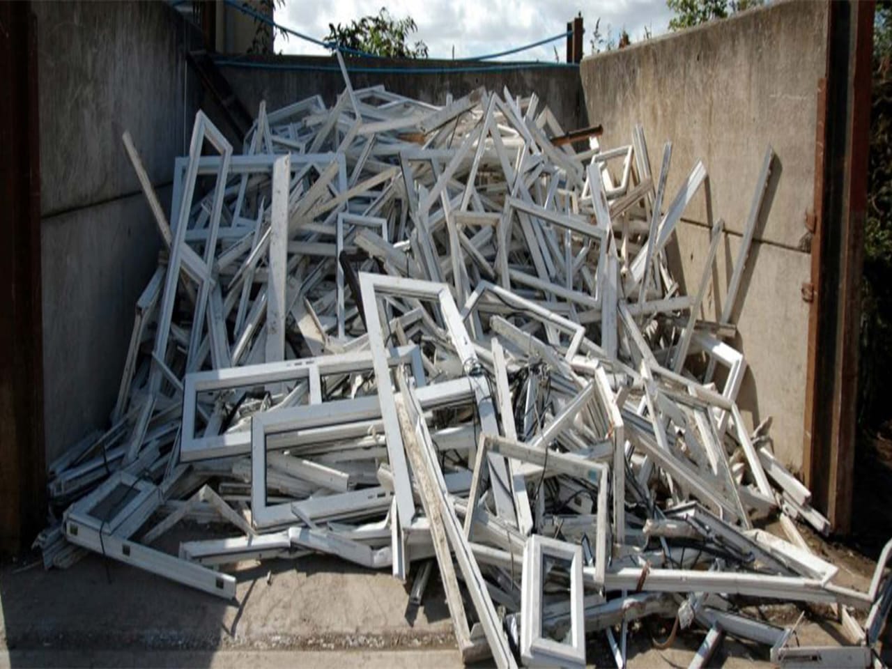 Dismantled window frames and fittings ready for resale